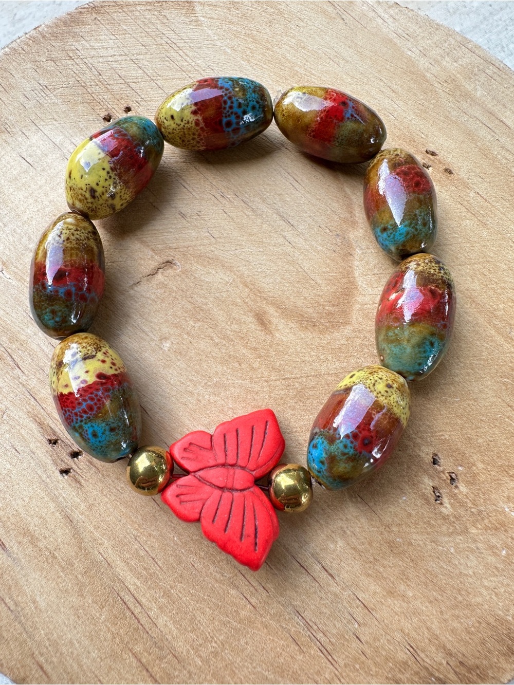 Handcrafted Multicolor Ceramic Bead Bracelet with Red butterfly Accent